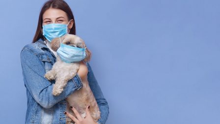 young-girl-wearing-medical-mask-with-her-pet (1)