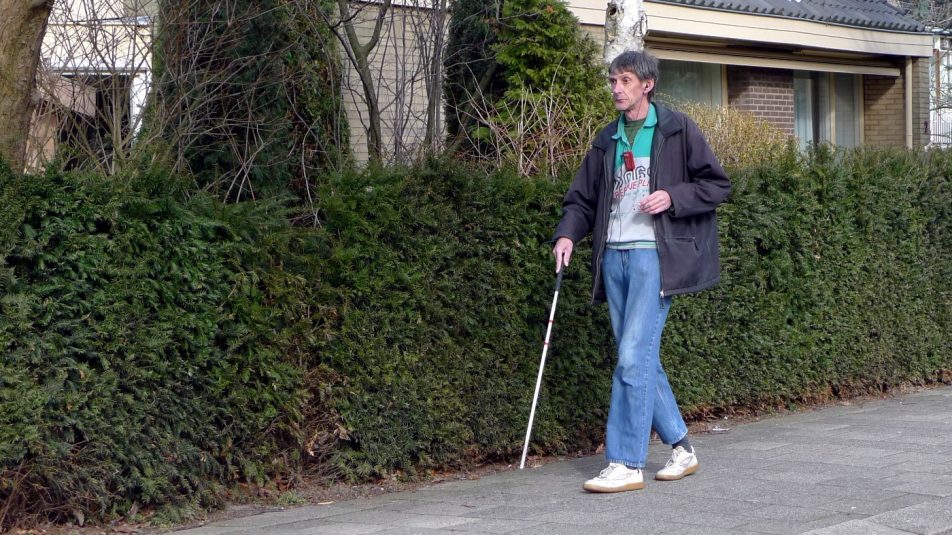 Visually_impaired_with_identification_cane